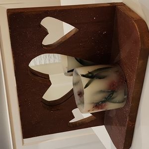 Heart cutout wood shelf with mirror.